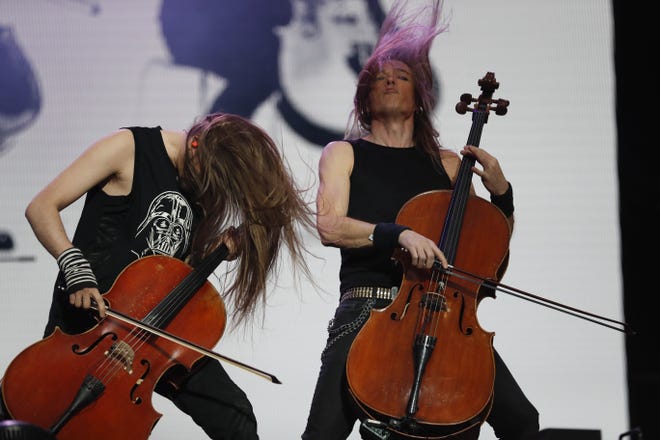 Perttu Kivilaakso, left, and Eicca Toppinen, of Apocalyptica perform at the Domination Music Festival in Mexico City, Saturday, May 4, 2019. [AP Photo/Eduardo Verdugo]