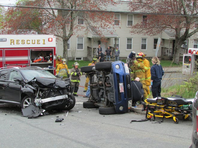Grafton firefighters work to free the driver of the Toyota Rav4. The two-car crash occured Monday at 11:43 a.m. [The Grafton News/Richard Price photo]