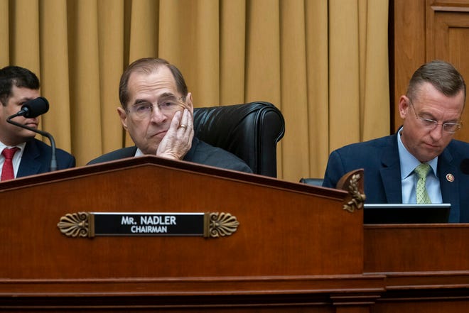 House Judiciary Committee Chair Jerrold Nadler, D-N.Y., joined at right by Rep. Doug Collins, R-Georgia, the ranking member, waits to start a hearing on the Mueller report without witness Attorney General William Barr who refused to appear, escalating an already acrimonious battle between Democrats and the Justice Department, on Capitol Hill in Washington, Thursday, May 2, 2019. (AP Photo/J. Scott Applewhite)
