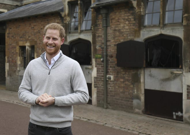 Britain's Prince Harry speaks at Windsor Castle on Monday after his wife, Meghan, the Duchess of Sussex, gave birth to a baby boy. [Steve Parsons / Pool via AP]