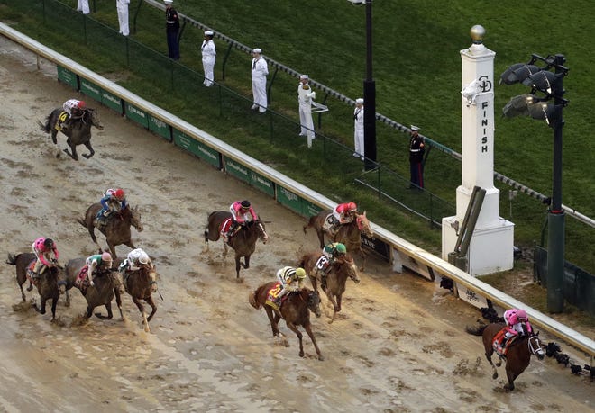 Luis Saez rides Maximum Security to the finish line first against Flavien Prat on Country House during the 145th running of the Kentucky Derby horse race at Churchill Downs on Saturday, May 4, 2019, in Louisville, Ky. Country House was declared the winner after Maximum Security was disqualified following a review by race stewards. [The Associated Press / Charlie Reidel]