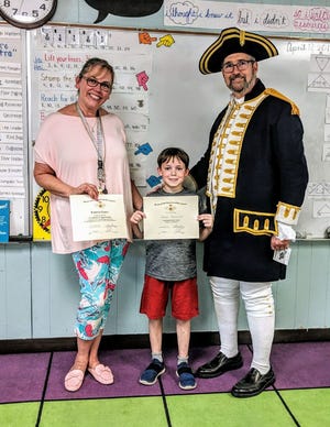 Pictured from left to right: Mrs. Kimberly Cromer (3rd Grade Teacher), Hayden Greenlaw (Poster Winner), and Jay DeLoach (NCSSAR New Bern Chapter President). [Contributed photo]