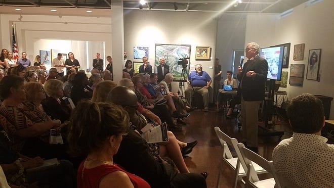 Victor Dover speaks to a crowd of more than 200 at the Panama City Center for the Arts on Monday. [KATIE LANDECK/THE NEWS HERALD]
