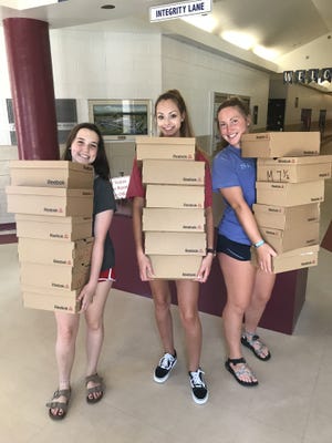 The youth group set a goal to collect 300 shoes for students at Walker Elementary. [CONTRIBUTED PHOTO]