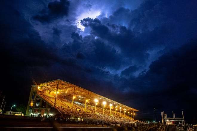 Lightning fills the skies as concert goers take to shelter as a severe thunderstorm approaches from the north over the Grandstand during the Illinois State Fair at the Illinois State Fairgrounds, Thursday, Aug. 16, 2018, in Springfield, Ill. [Justin L. Fowler/The State Journal-Register]