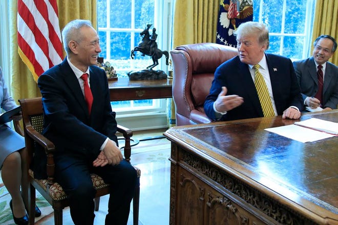 In this April 4, 2019, file photo, President Donald Trump meets China's Vice Premier Liu He in the Oval Office of the White House in Washington.