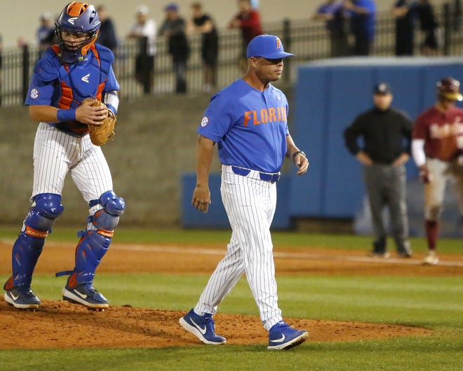 Florida coach Kevin O'Sullivan has made frequent trips to the mound this year, as his pitchers have not been as productive as in seasons past. [Brad McClenny/GateHouse Media]