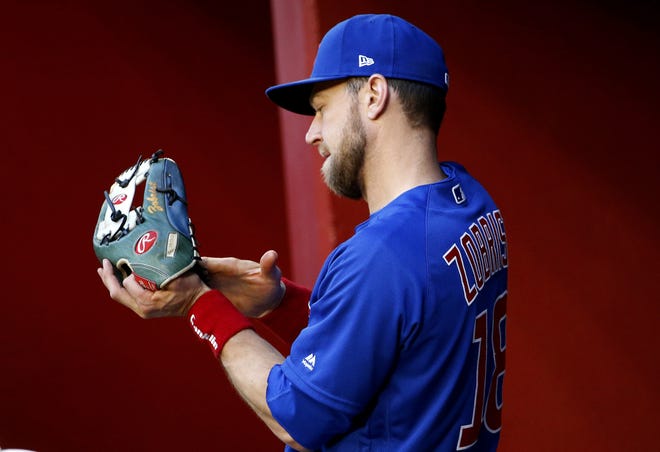 Chicago Cubs second baseman Ben Zobrist rubs up his glove prior to the start of a baseball game against the Arizona Diamondbacks, Friday, April 26, 2019, in Phoenix. (AP Photo/Ralph Freso)