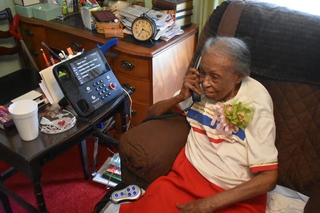 Ruby Mae Kornegay takes a phone call on her 103rd birthday on Friday, May 3rd, in Kinston. [Matt Hinson/Kinston Free Press]