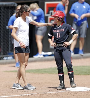 Texas Tech coach Adrian Gregory talks to Taylor Satchell (11) while she stands on third base during a non-conference game last Sunday against Kentucky at Rocky Johnson Field. The No. 15 Red Raiders have won their last two games heading into an 11 a.m. Friday game against Kansas in the Big 12 Conference Tournament. [Brad Tollefson/A-J Media]