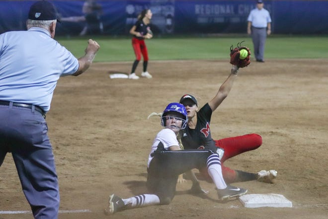 Middleburg third baseman Haleigh Wright awaits confirmation that her tag of Bartram Trail's Mackenzie Williams was in time during the sixth inning of a Region 1-7A quarterfinal Wednesday in St. Johns. [WILL BROWN/THE RECORD]