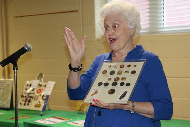 Janice Roxberg, president of the Iowa State Button Society, speaks to a group that gathered last Thursday evening by invitation of the Huxley Historical Society. Photo by Marlys Barker