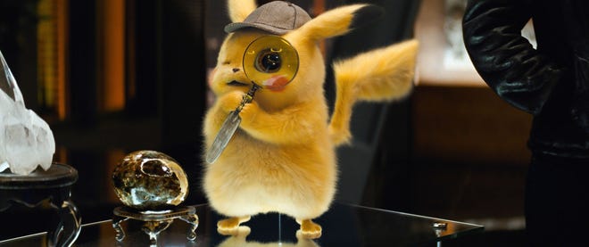 The titular yellow gumshoe is voiced by Ryan Reynolds in "Pokemon Detective Pikachu." [Warner Bros. Pictures via AP]