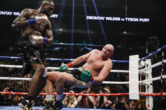 Deontay Wilder knocks Tyson Fury down in a WBC heavyweight bout on Saturday, Dec. 1, 2018. Showtime Sports will premier its latest All Access installment, Wilder vs. Breazeale on Friday. The Sports Emmy Award-winning series is supposed give an inside look and chronicle the recent lives and training camps of the two American heavyweights. It’ll air on Showtime at 9 p.m. CT. [Photo/Esther Lin/SHOWTIME Sports]