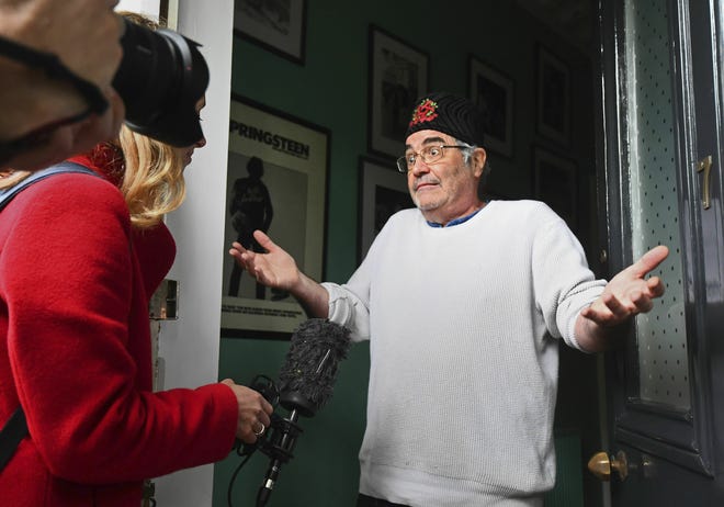 Danny Baker speaks to the media at his London home on Thursday, May 9, 2019. A BBC DJ has been fired after using a picture of a chimpanzee in a tweet about the royal baby born to Meghan the Duchess of Sussex and her husband Prince Harry. Danny Baker tweeted Thursday that he has been fired after posting an image of a couple holding hands with a chimpanzee dressed in clothes and the caption: "Royal baby leaves hospital." (Victoria Jones/PA via AP)