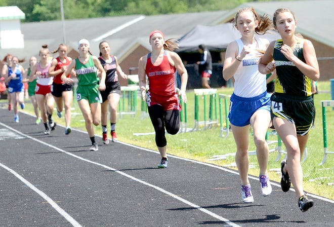 Shenandoah High's Kendall Mackie leads the pack in the girls' 800-meter run during Saturday's 27th WesBanco Shamrock Relays in Barnesville.
