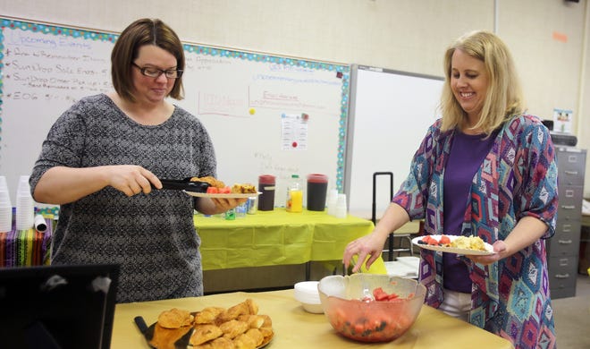 From left, Kylie Larsen and Dana Roderick take a break from a busy school day to enjoy a teacher appreciation brunch at Union Elementary School on Thursday. [Brittany Randolph/The Star]