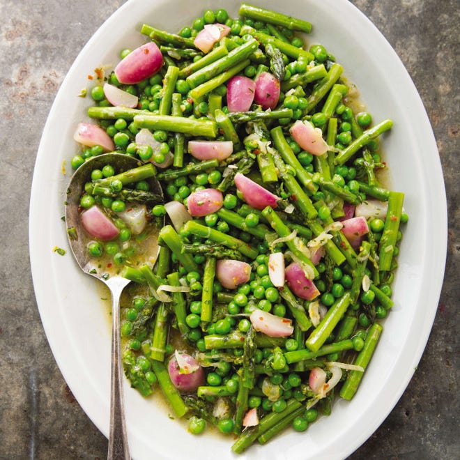 This Braised Spring Vegetables with Tarragon recipe appears in the cookbook "How to Braise Everything." (Joe Keller/America's Test Kitchen via AP)