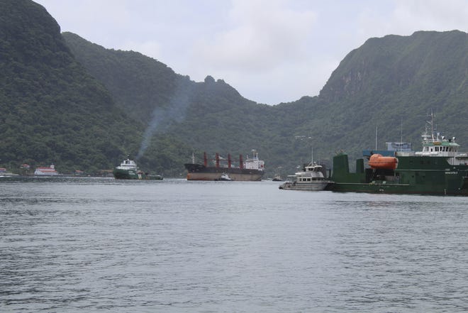 The North Korean cargo ship, Wise Honest, middle, was towed into the Pago Pago Harbor on Saturday, in Pago Pago, American Samoa. On the right are vessels docked along the harbor. The Wise Honest was seized by the U.S. because of suspicion it was used to violate international sanctions. It arrived Saturday at the capital of this American territory. [Fili Sagapolutele/AP Photo]