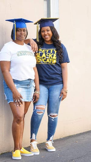 Nina Ussery and her daughter, Lyric Ussery, both graduated from college Friday. Nina Ussery earned a degree from Limestone College while Lyric earned hers from UNC Greensboro. [Photo by Kenya Jade]