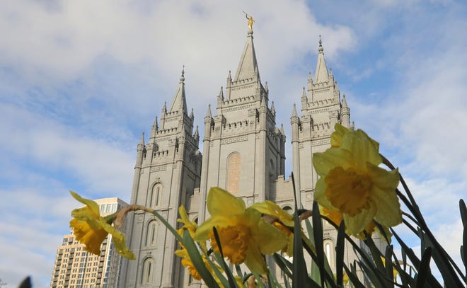FILE - In this April 6, 2019, file photo, the Salt Lake City temple is shown during The Church of Jesus Christ of Latter-day Saints' two-day conference, in Salt Lake City. The Church of Jesus Christ of Latter-day Saints is changing wedding rules in hopes of preventing family members who aren't church members from feeling excluded. The faith said Monday, May 6, 2019 in a news release that couples who get married in civil ceremonies will no longer have to wait one year to do a temple wedding ceremony that only church members in good standing can attend. (AP Photo/Rick Bowmer, File)