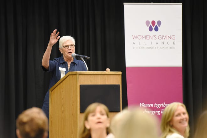 Mary Pietan, president of the Women's Giving Alliance, makes the opening comments to kick off the organization's member forum Monday. The group released an impact report on its 2012-16 mental-health funding cycle, which served about 8,800 women and girls, and ratified grants for its current funding focus, helping women escape poverty. [Bob Self/Florida Times-Union]