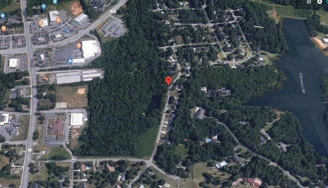 The wooded property shown at the center of this aerial image, between Union Road and Robinwood Lake, is where 51 homes will soon be built at the corner of Elam Street and Winterlake Drive. [Google Maps]