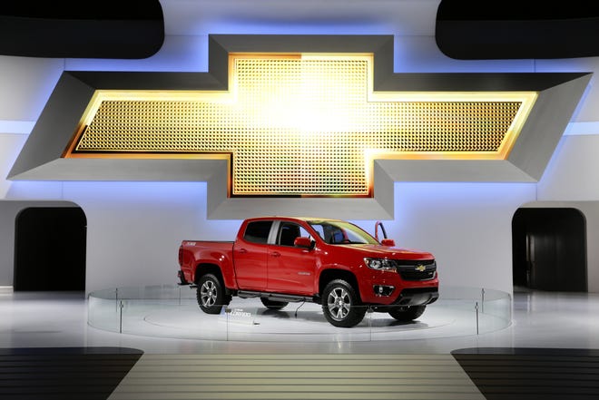 FILE - In this Nov. 21, 2013, file photo the new 2015 Chevrolet Colorado pickup truck is on display at the Los Angeles Auto Show in Los Angeles. U.S. highway safety regulators are investigating whether General Motors went far enough when it recalled about 3,000 small pickup trucks in 2016. The National Highway Traffic Safety Administration is looking into whether GM should recall about 115,000 Chevrolet Colorado and GMC Canyon pickups from the 2015 model year. The agency says it has received 50 complaints about failures from owners of trucks that werenþÄôt included in the 2016 recall. (AP Photo/Jae C. Hong, File)