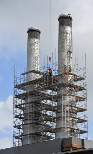 The smoke stacks get special attention at the Plant Riverside District on Savannah's riverfront. [Steve Bisson/savannahnow.com]