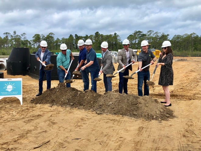 Representatives of developer QSL, contractor EBM Inc. and the Beach chamber of commerce broke ground on the $34-million senior community on Friday. [ED OFFLEY/THE NEWS HERALD]