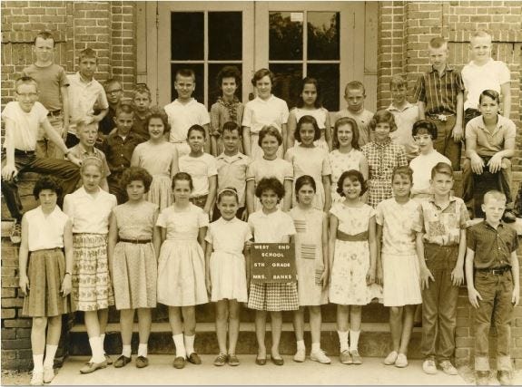 West End Elementary School, 1962-63: This was the fifth grade class of Mrs. Banks.

First row from left are Karen Windham, Linda Ballard, Sheila Robertson, Diane Gast, Unknown, Unknown, Cathy Barrett, Carol Yaw, Debbie Booth, Claude Yaw, Larry Jordan.

Second row from left are Sam Kirby, Barry Reinhart, Bill Adkison, Sara Ball, Gary Taylor, Ronnie Herdon, Sue Day, Brenda Ray, Nancy Cade, Kay Franks, Lillie Banks-Teacher, Jim Netto.

Third row from left are Jerry Logan, Richard Graham, Jerry Pearson, Rodney?, Paul Eatmon, Charlotte Bailey, Susan Herrington, Unknown, Stanley Redding, Larry Nix, Thomas Lindsay, Mike McMillan. 

If you can identify unknown students reach bettyslowe6@gmail.com or call 205-722-0199.

[Photo submitted by Bill Adkison]