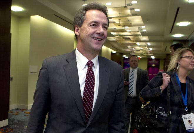 In this Feb. 23, 2019, file photo, Montana Gov. Steve Bullock walks to a meeting during the National Governors Association 2019 winter meeting in Washington. (AP Photo/Jose Luis Magana, File)