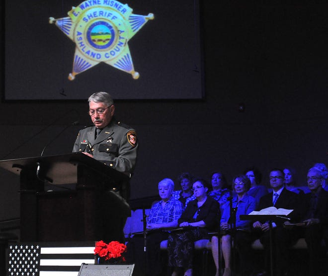 Ashland County Sheriff E. Wayne Risner addresses law enforcement and community members during the county's annual fallen officer memorial ceremony at Calvary Baptist Church.