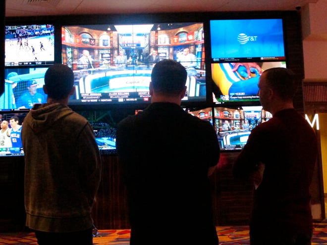 Since sports betting became legal last year in New Jersey, the state's casinos and racetracks had taken more than $2.6 billion worth of bets through the end of April. [Wayne Parry / Associated Press]