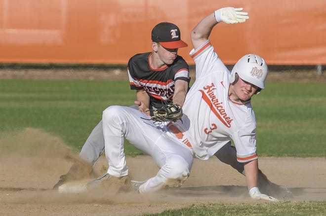 Mount Dora's Hunter Andrews (3) slides into second as Leesburg's Mike Woodley (4) reaches for the tag on April 29 in Mount Dora. Mount Dora takes a 15-12 record on the road to face Newberry to open the state playoffs. [PAUL RYAN / CORRESPONDENT]