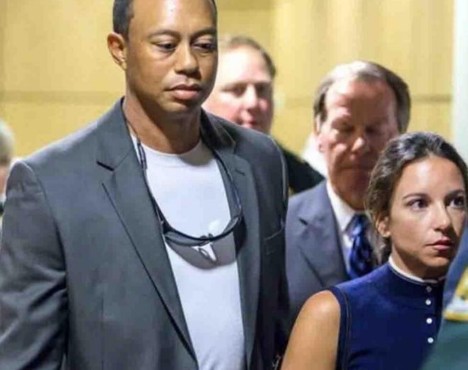 Tiger Woods and his girlfriend Erica Herman are being sued by the parents of a man who allegedly was overserved at a restaurant the pro golfer owns. [LANNIS WATERS/PALM BEACH POST]