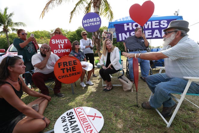 U.S. Rep. Debbie Mucarsel-Powell, center, D-Fla., talks with demonstrators before attempting to enter the Homestead Temporary Shelter for Unaccompanied Children last weekin Homestead. Mucarsel-Powell was denied access to the shelter. [WILFREDO LEE/THE ASSOCIATED PRESS]