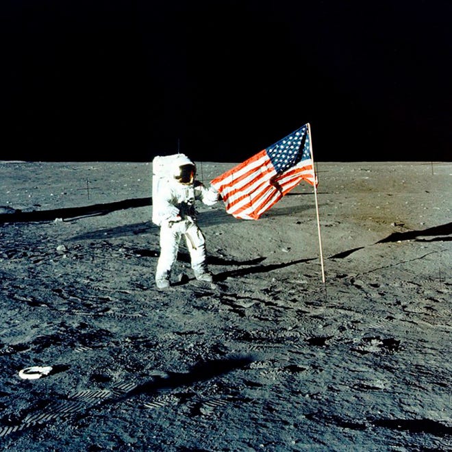 Apollo 12 mission Commander Charles P. "Pete" Conrad stands on the moon's surface in November 1969. He was the third man to walk on the moon. On Tuesday, NASA's chief says the Trump administration's proposed $1.6 billion budget boost is a "good start" for putting astronauts back on the moon. [NASA]