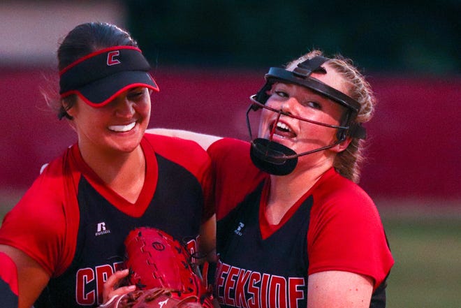 Creekside pitcher Mallorie Sykes, right, thanks shortstop Jenae Wash for starting a double play to end the fourth inning in Tuesday's Region 1-7A softball semifinal at Middleburg. [WILL BROWN/THE RECORD]