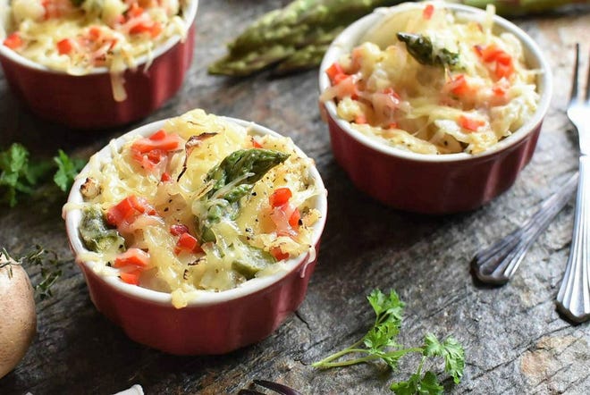 Fresh asparagus of spring is so amazing that adding it in to these creamy au gratin potatoes takes the dish from ordinary to extraordinary. Simply spear it.