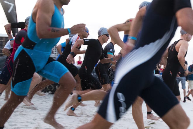 IRONMAN 70.3 Gulf Coast, a half triathlon, was held on Saturday. [JOSHUA BOUCHER/THE NEWS HERALD]