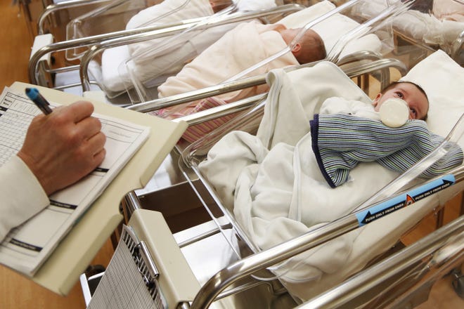 Newborn babies in the nursery of a postpartum recovery center in upstate New York. According to a government report released Wednesday, U.S. birth rates reached record lows for women in their teens and 20s, leading to the fewest babies in 32 years. [Seth Wenig/AP Photo]