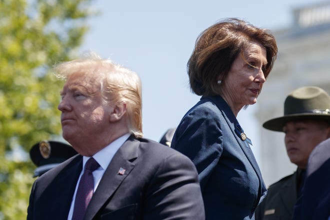 President Donald Trump and Speaker of the House Nancy Pelosi of California attend the 38th Annual National Peace Officers' Memorial Service at the U.S. Capitol Wednesday in Washington. Pelosi said Wednesday that the U.S. must avoid war with Iran and she warned the White House has “no business” moving toward a Middle East confrontation without approval from Congress. [EVAN VUCCI/ASSOCIATED PRESS]