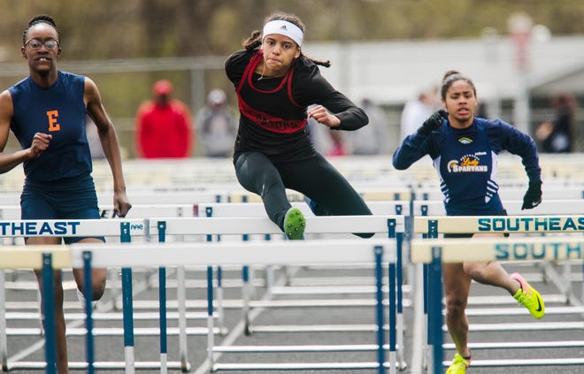 Springfield's Lauren Ferguson finishes third in the 100 hurdles during the 2019 Thomas McBride Invitational at Southeast High School Saturday, April 13, 2019. [Ted Schurter/The State Journal-Register]