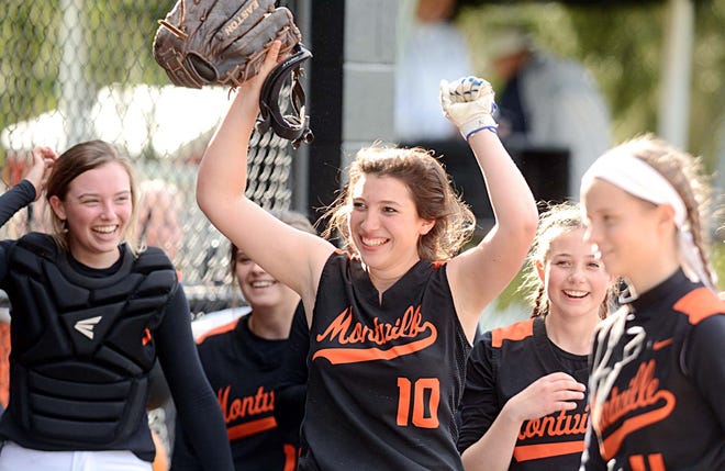 Montville pitcher Alexis Michon, center, celebrates with her teammates after their 4-0 win over Ledyard Wednesday in Montville. [John Shishmanian/ NorwichBulletin.com]