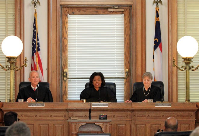 Senior Associate Justice Paul Newby, at left, Chief Justice Cheri Beasley and Associate Justice Robin Hudson preside at a special session of the Supreme Court of North Carolina at New Bern City Hall in New Bern, N.C., May 15, 2019. The May court session is part of the Supreme Court Bicentennial Anniversary celebration events in eastern North Carolina. [Gray Whitley/Gatehouse Media]