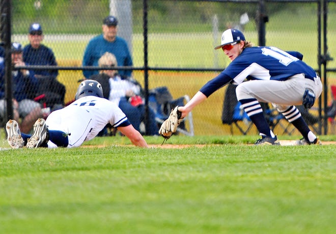 Dallastown's Darren Sciortino, right, catches the ball to get an out on West York's Gabe Allen at third base during York-Adams League baseball semifinal action at Spring Grove High School on Wednesday, May 15. Dallastown would win the game 12-0. The Wildcats are the No. 2 seed in the upcoming District 3 Class 6-A playoffs. Dawn J. Sagert photo