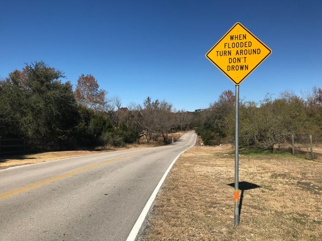 The low-water crossing on Great Divide Drive has been a topic for discussion for months as the city and county find a solution that residents want. [LUZ MORENO-LOZANO/LAKE TRAVIS VIEW]