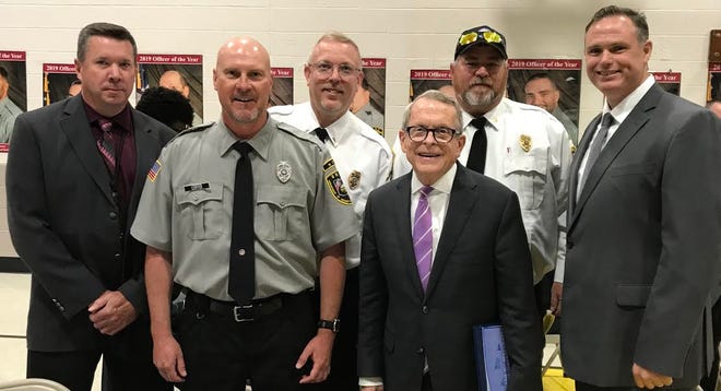Noble Correctional Institution recently selected Sonny Leiffer as Correctional Office of the Year and Mark Hiatt as Employee of the Year for 2019. Pictured are, from left, Deputy Warden Craig Aufdenkampe, Leiffer, Hiatt, Ohio Gov. Mike DeWine, Maj. Sean Frizzell and Warden Tim Buchanan.