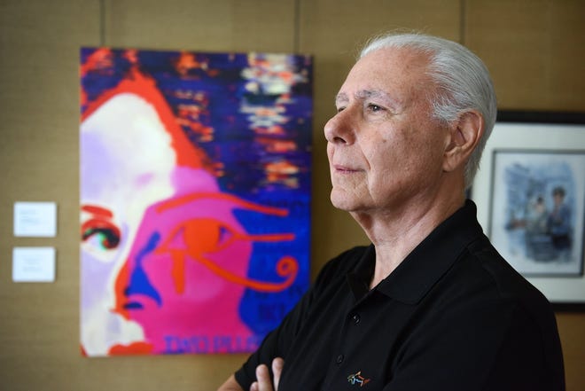 Phil Growick, who curated "The Art of Sherlock Holmes" at the Ann Norton Sculpture Gardens in West Palm Beach, stands next to Vicki Siegel's painting "The Mystery," which accompanies his story "Two Plus Two." [Melanie Bell/palmbeachdailynews.com]